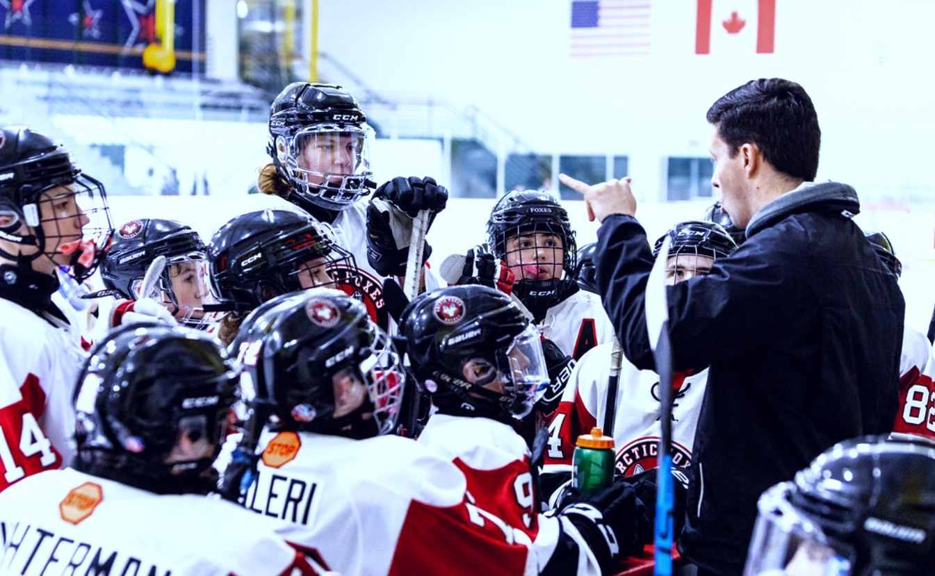 Youth hockey team with their coach